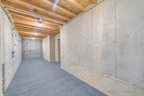 Interior view of a residential food storage room with insulated wall and ceiling