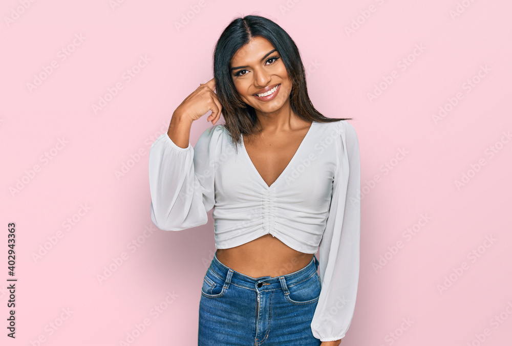 Young latin transsexual transgender woman wearing casual clothes smiling pointing to head with one finger, great idea or thought, good memory Young latin transsexual transgender woman wearing casual clothes smiling pointing to head with one finger, great idea or thought, good memory
