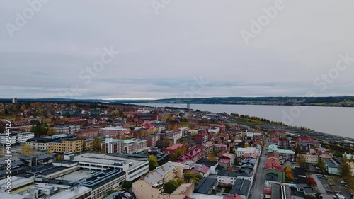 Drone Flying Above Urban Landscape Of Ostersund In Jamtland, Sweden With Storsjon Lake In Background - aerial photo