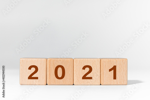 The number 2021 is printed on the building block