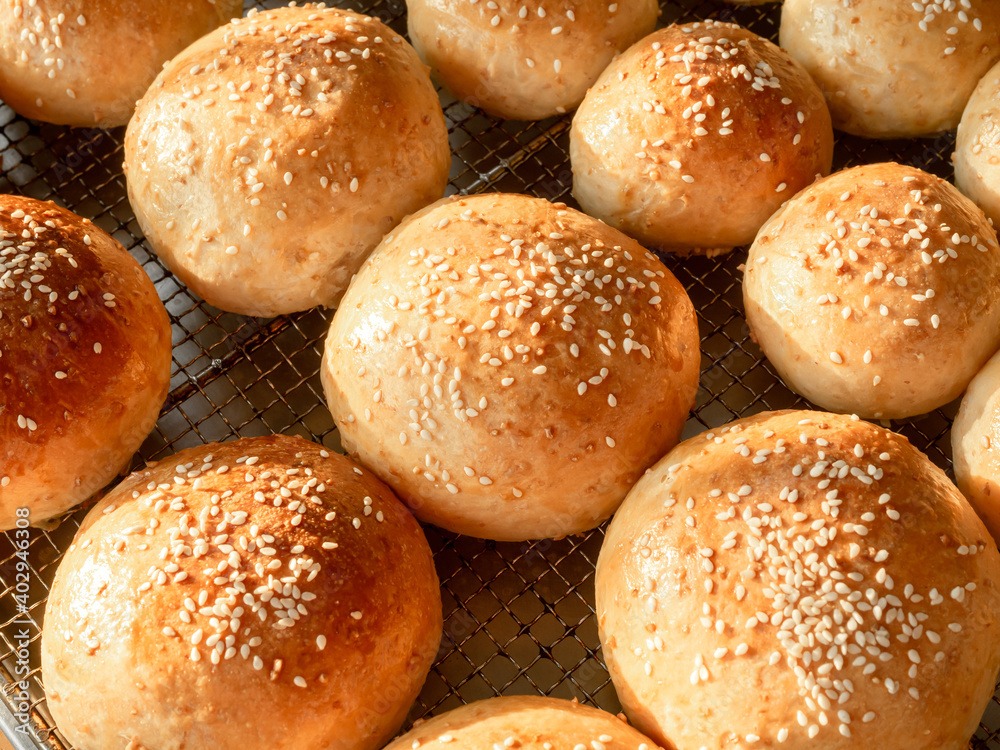 Fresh homemade burger buns with sesame seed. Fresh homemade burger buns with sesame seed.