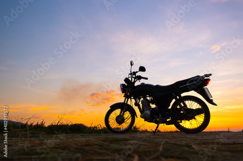 Motorcycle in sunset and sunrise with copy space.Silhouette motorbike