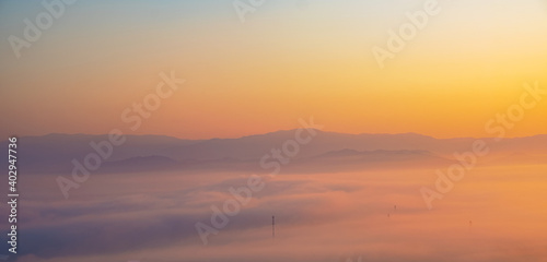 Surreal landscape of morning foggy..Morning clouds at sunrise.Landscape of fog and mountains of northern Thailand. © gexphos