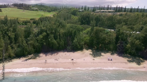 Aerial view of Slaughterhouse Beach washed by calm wave of turquoise ocean, Maui photo