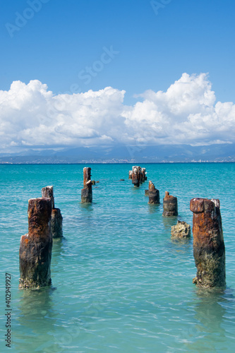  The remnants of an old dock in the turquoise water off Isla de Cajo de Muertos, Puerto Rico, USA.   photo