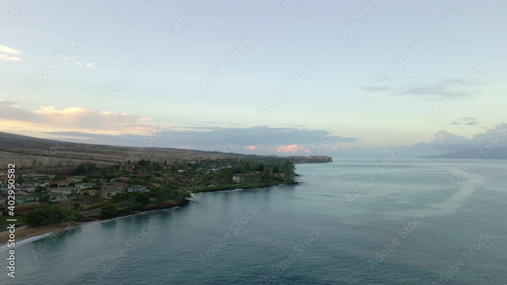 Aerial panorama of West Maui coast with oceanfront resorts at sunrise