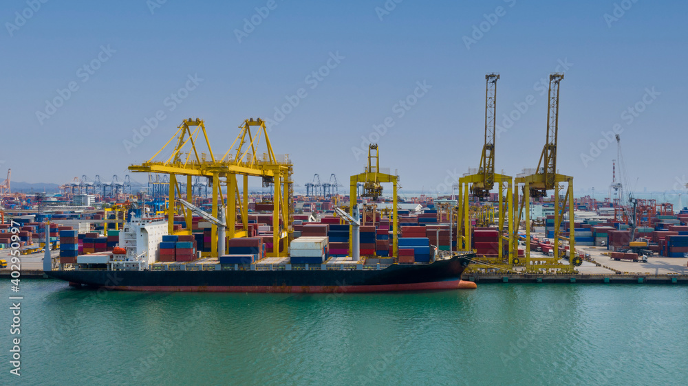 Container ship terminal, and quay crane of container ship at industrial port with shipping container vessel, Maritime cargo freight ship import export business service logistic international transport
