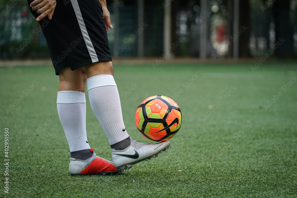 Bangkok/Thailand - August 2018: Football player is training on field with  Nike Phantom Vision Elite. This is new football boots designed for  Playmaker. Presented by Kevin De Bruyne and Coutinho. Stock Photo