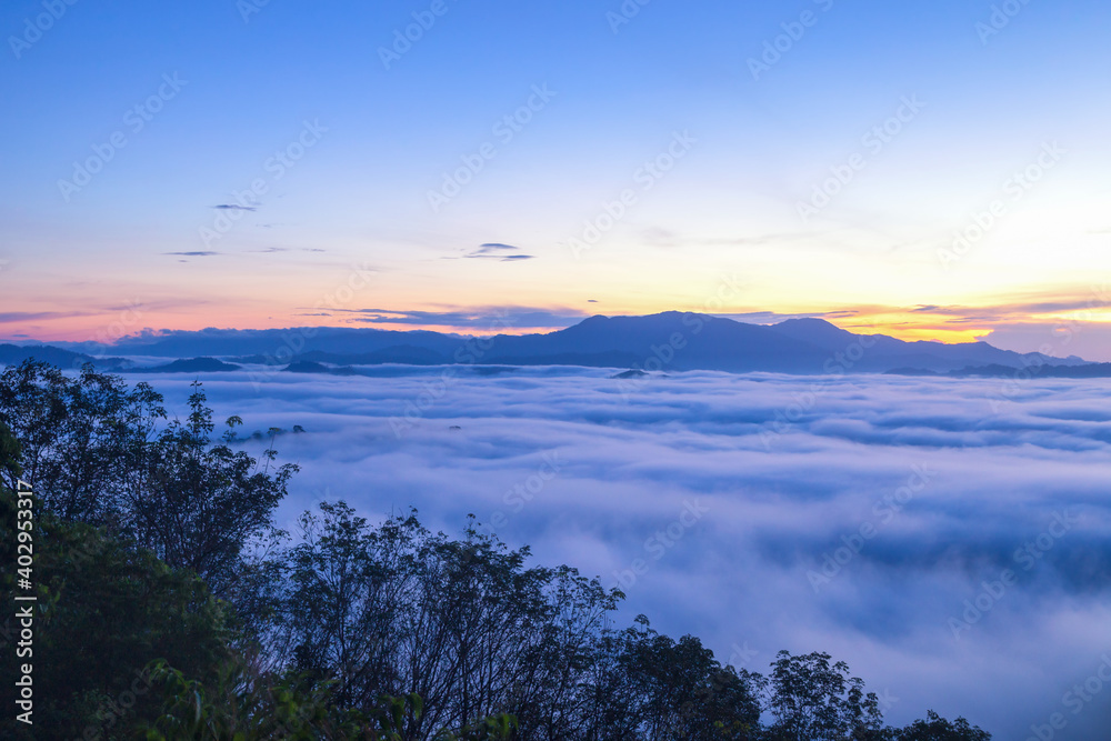 Beautiful flowing clouds and the mist in front of the mountains at Khao Khai Nui in sunrise time.