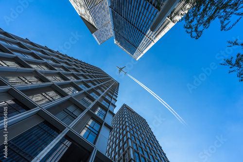 plane flying over the skyscrapers