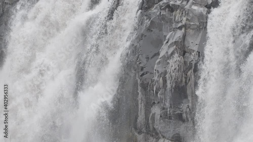 Close Up Slow Motion Frozen Icy Waterfall - Shallow DOF photo