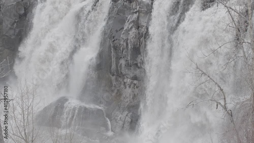 Slow Motion Icy Oregon Waterfall on Foggy Day - Shallow DOF photo