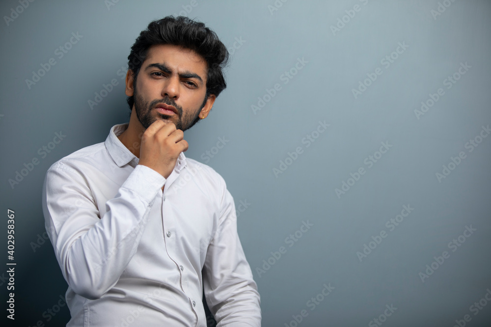 AN OFFICE EXECUTIVE LOOKING STRAIGHT AND THINKING AN OFFICE EXECUTIVE LOOKING STRAIGHT AND THINKING