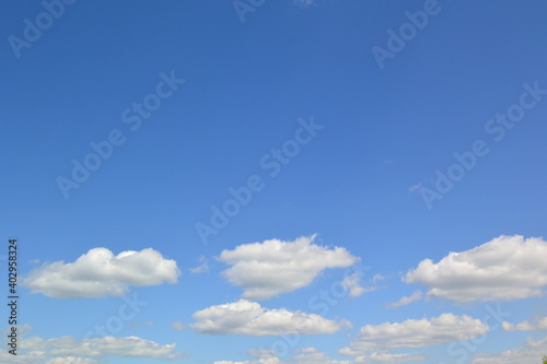 fluffy clouds and clouds in the blue sky
