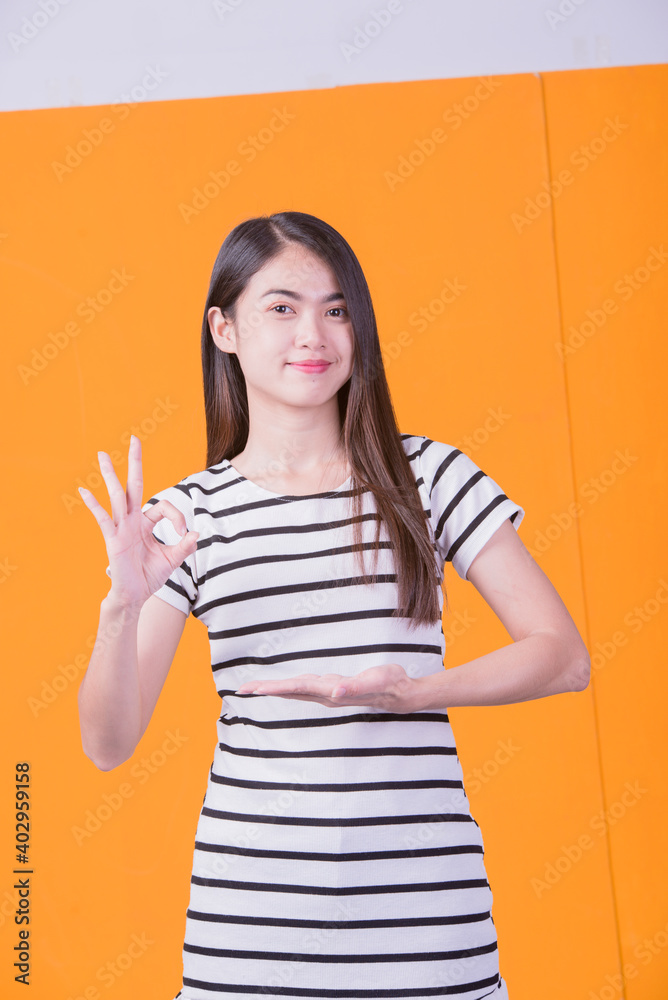 Young Asian Girl Lifestyle Happy Asian Girl On Yellow Background Young Asian Girl Lifestyle Happy Asian Girl On Yellow Background