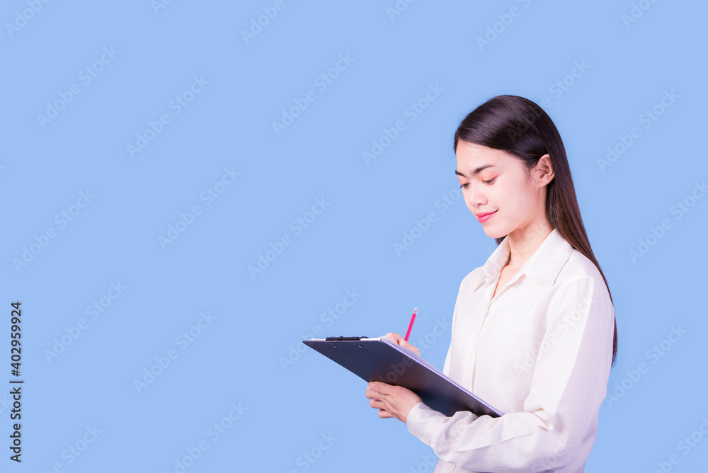 Businesswoman with a stern face on a blue background, studio portrait. Businesswoman with a stern face on a blue background, studio portrait.