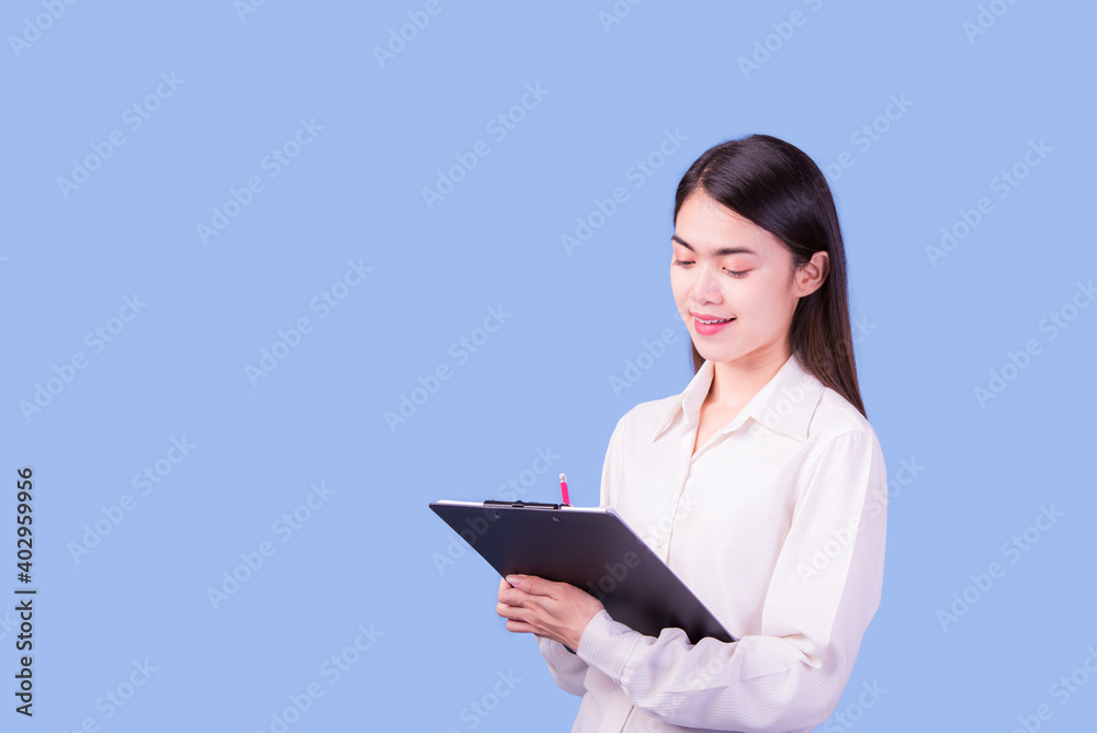 Businesswoman with a stern face on a blue background, studio portrait. Businesswoman with a stern face on a blue background, studio portrait.