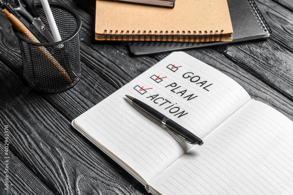 Text GOAL PLAN ACTION in notebook and pen on wooden background - obrazy, fototapety, plakaty 