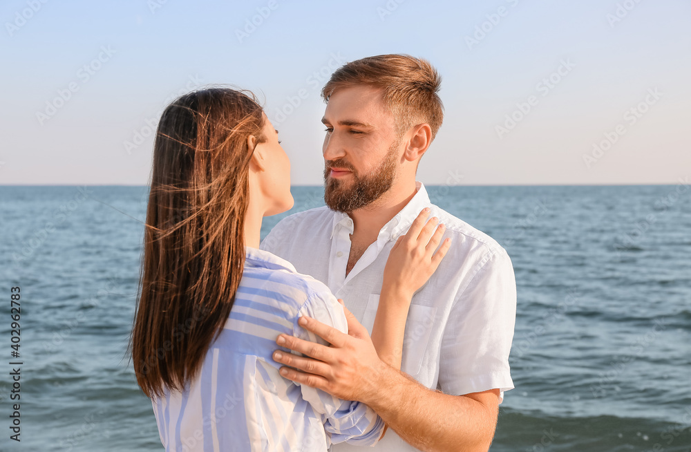 Happy young couple on sea beach Happy young couple on sea beach