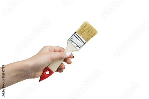 Female hand with brush isolated on white background.