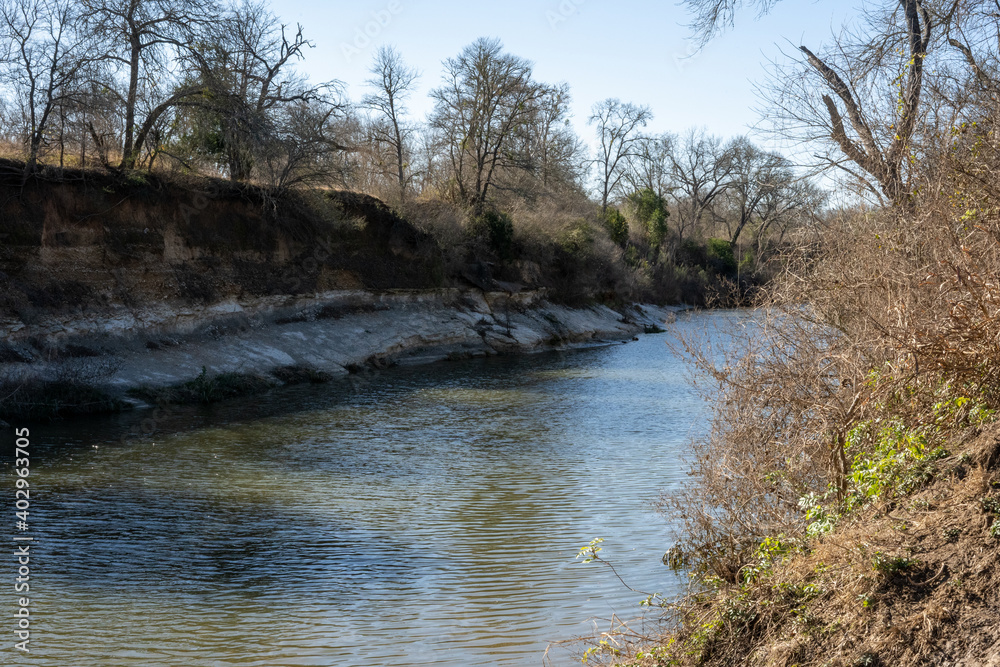 A flowing creek in a thickly forested area in the Texas Hill Country near Austin A flowing creek in a thickly forested area in the Texas Hill Country near Austin