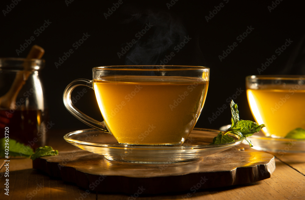 green tea with mint leaf on wooden table	