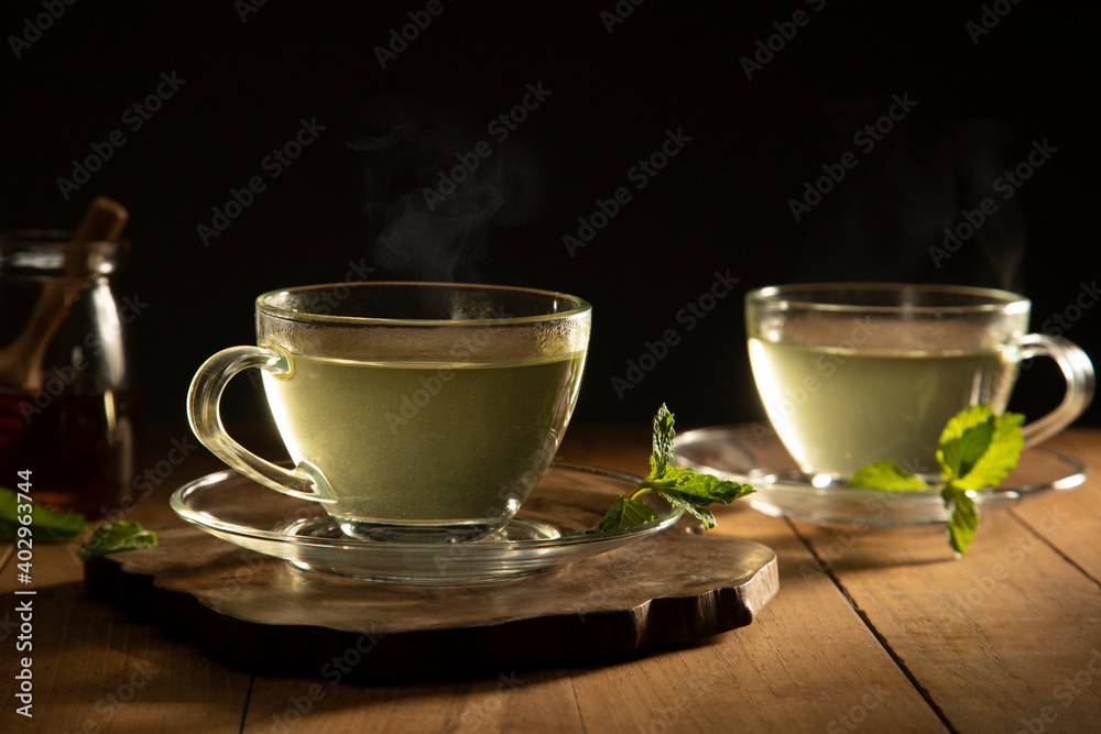 green tea with mint leaf on wooden table green tea with mint leaf on wooden table