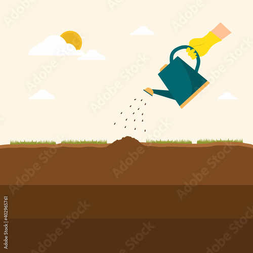 watering seeds, hand holdin...