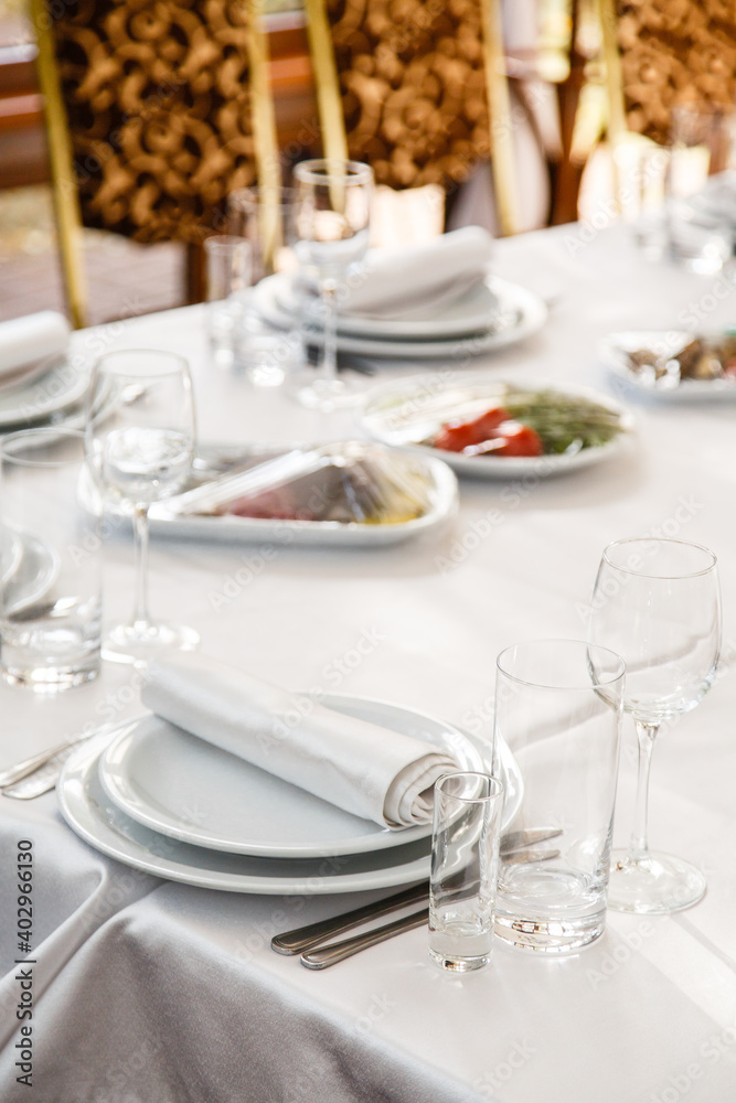 Table setting. Restaurant Served table for party in light neutral colors Table setting. Restaurant Served table for party in light neutral colors