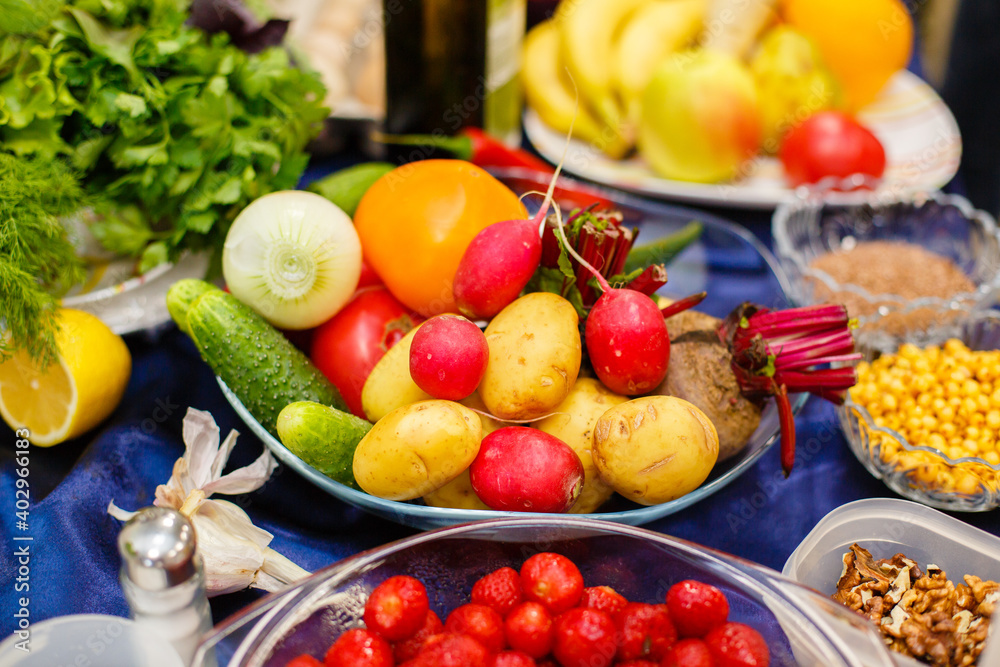 A lot of vegetables and fruits on the table. Proper and healthy food. Vibrant colors A lot of vegetables and fruits on the table. Proper and healthy food. Vibrant colors