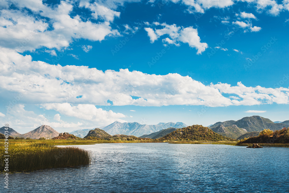 Lake in Montenegro against the backdrop of beautiful mountains in summer - beautiful nature in the reserve