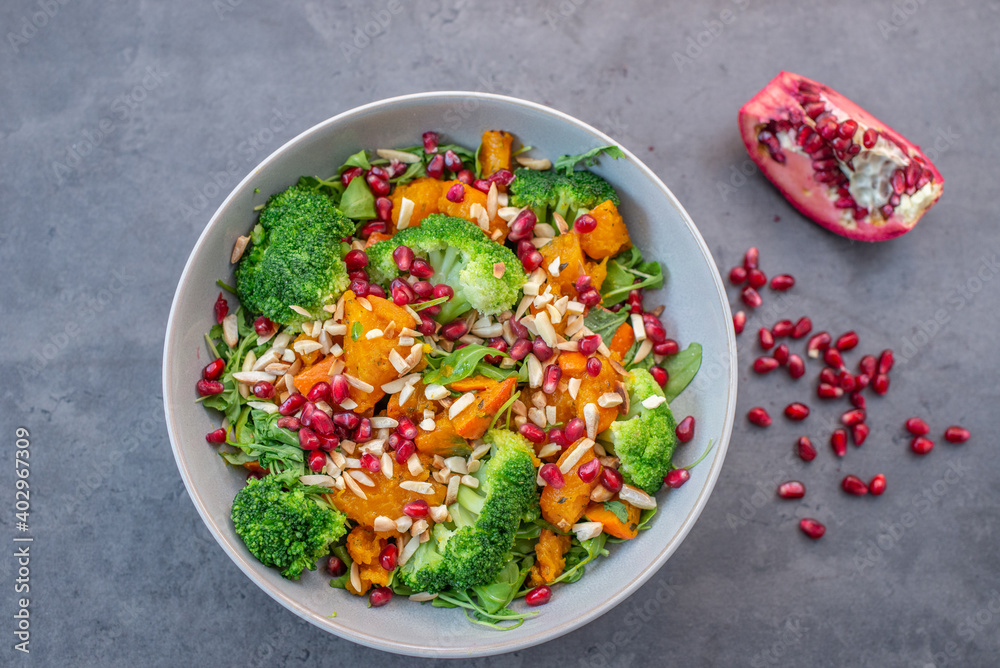 healthy tasty Broccoli salad with pomegranate on a table