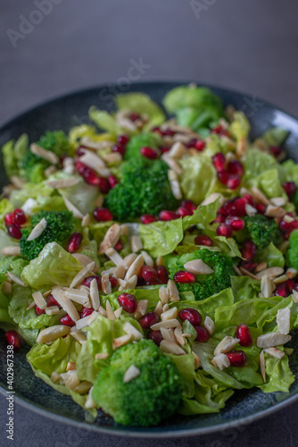 healthy tasty Broccoli salad with pomegranate on a table