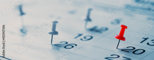 Schilderij op canvas Calendar page pinned in a calender on datebusiness meeting schedule, travel planning or project milestone and reminder concept