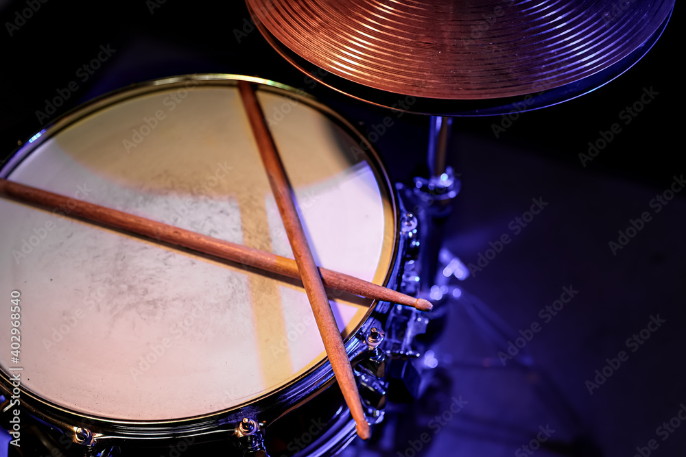 Obraz premium Drum sticks on a snare drum close up top view.