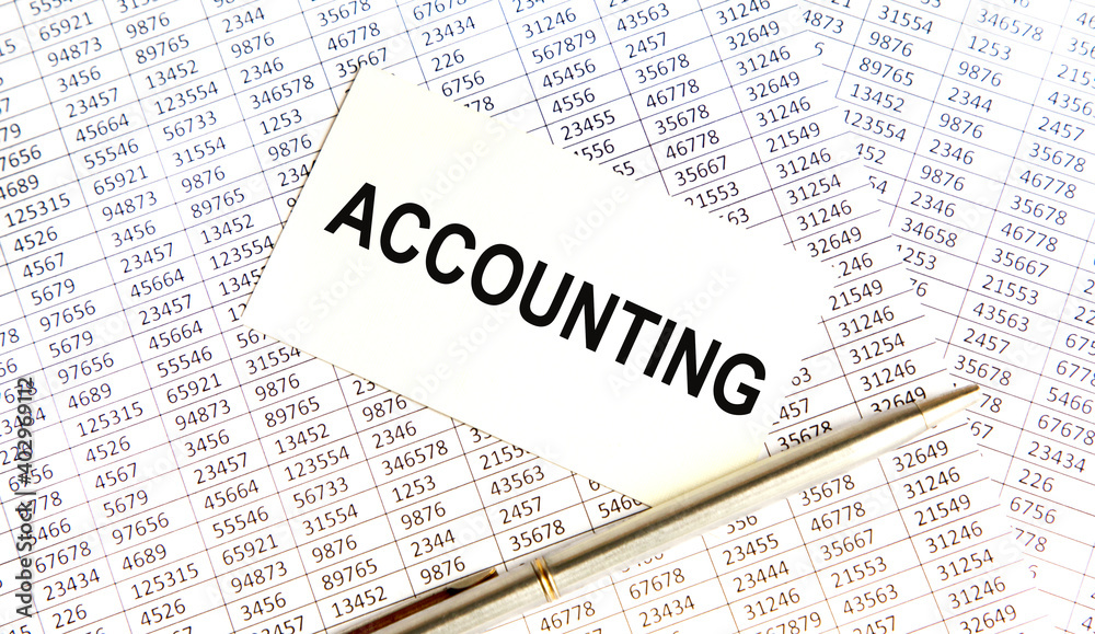 On the card the text of ACCOUNTING, next to the pen, the background are reports. On the card the text of ACCOUNTING, next to the pen, the background are reports.