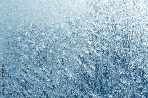 Frosty natural pattern on winter window
