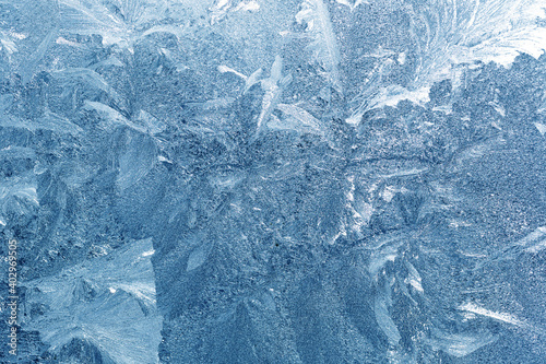 Frosty natural pattern on winter window
