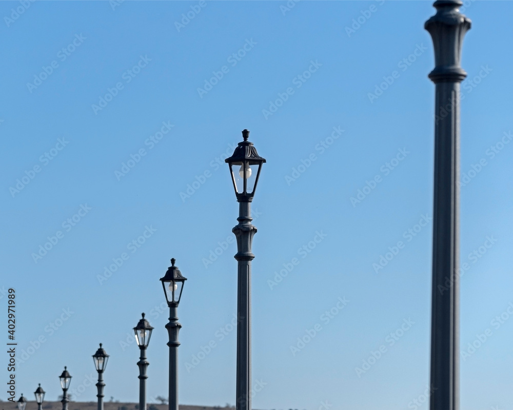 street lanterns on background sky