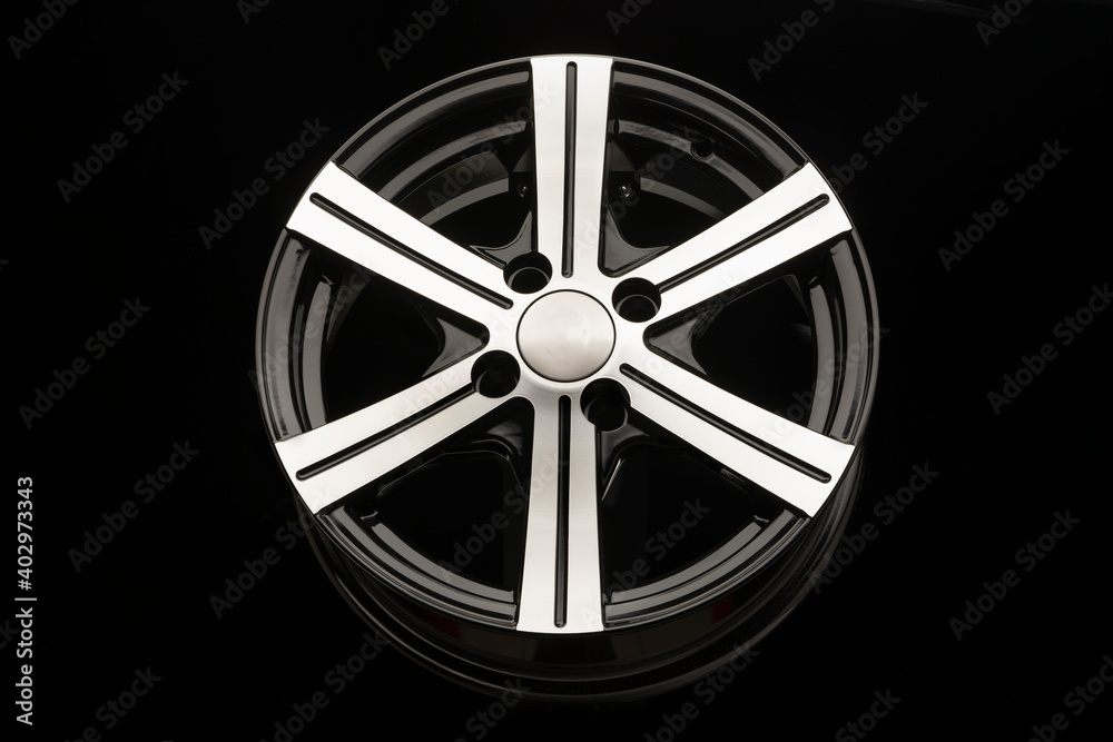 Obraz premium alloy wheel, black with polishing. front view close-up