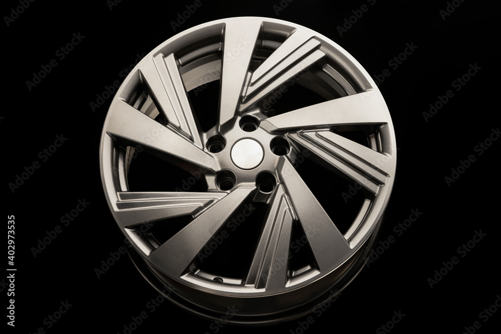 gray alloy wheel modern, close-up front view on a black background