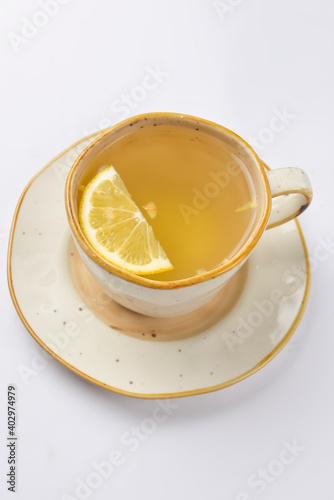 Cup with green tea over white background. Hot tea for cold weather.