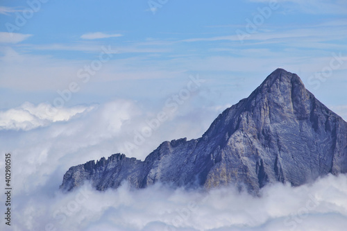amazing view of mountain peak in above the clouds i the swiss alps 
