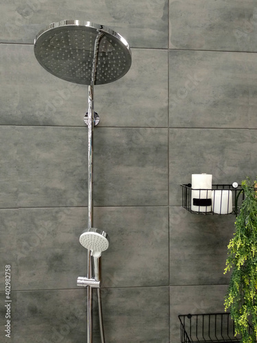 Luxury fully tiled shower with rain head and hand held shower rose.