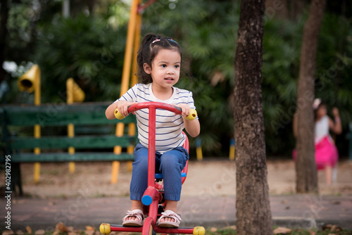 Little children having fun in the playground © NITIKAN T.