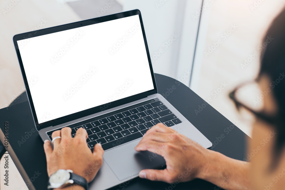 computer screen blank mockup.work using laptop with white background for advertising,contact business search information on desk at coffee shop.marketing and creative design computer screen blank mockup.work using laptop with white background for advertising,contact business search information on desk at coffee shop.marketing and creative design