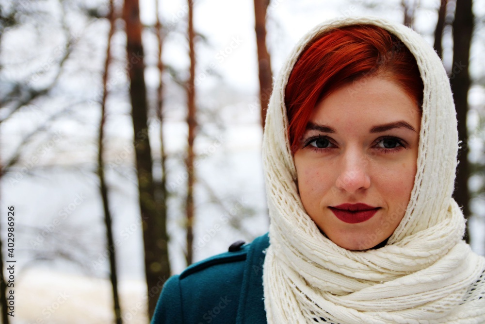 beautiful girl walking in the forest in winter beautiful girl walking in the forest in winter