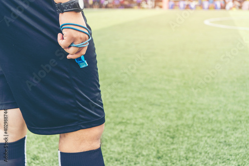 Bild auf Leinwand Closeup of Soccer referee  with whistle in the stadium during match