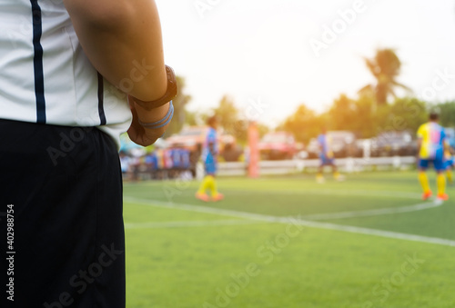 Closeup of Soccer referee with whistle in the stadium during match.