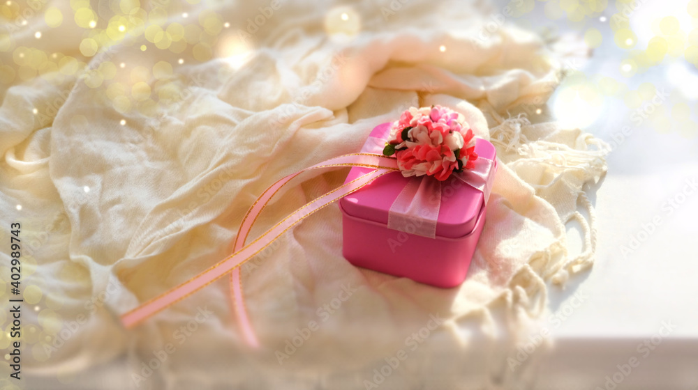 Blurred luxury pink gift box . Light and shadow. bedroom is decorated for holiday. Copy space Concept holiday. Happy Woman's Day, Mother's Day, Valentine's Day, Wedding Blurred luxury pink gift box . Light and shadow. bedroom is decorated for holiday. Copy space Concept holiday. Happy Woman's Day, Mother's Day, Valentine's Day, Wedding